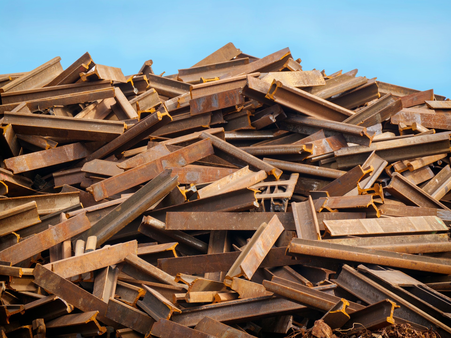 Stack of rusty old railway track sections